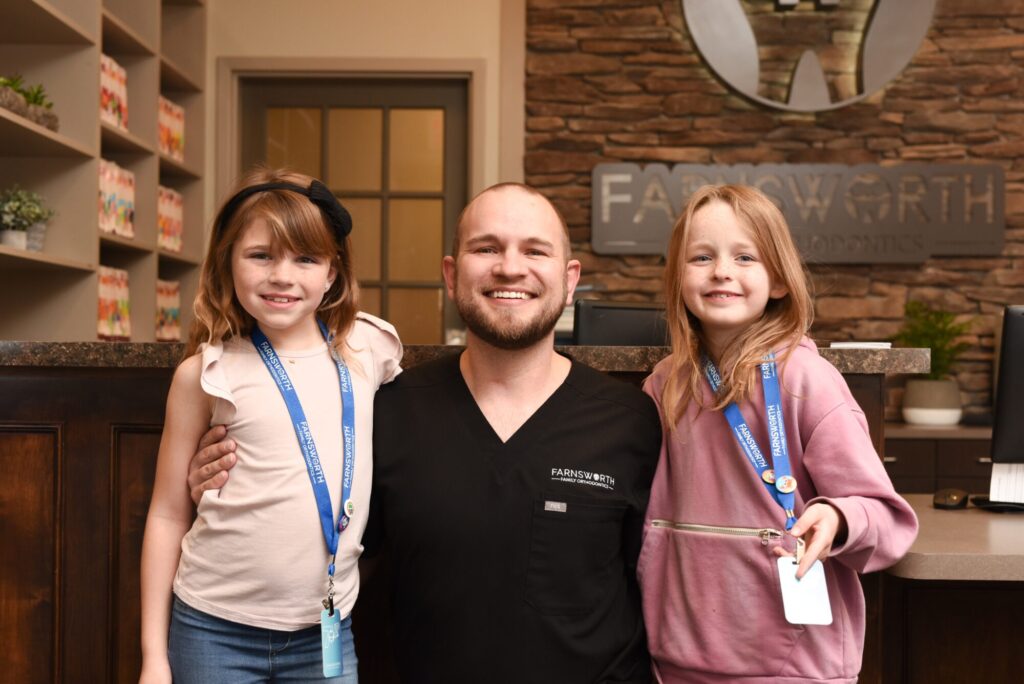 Two young girls smiling with their new Lubbock Braces with their Lubbock Orthodontist