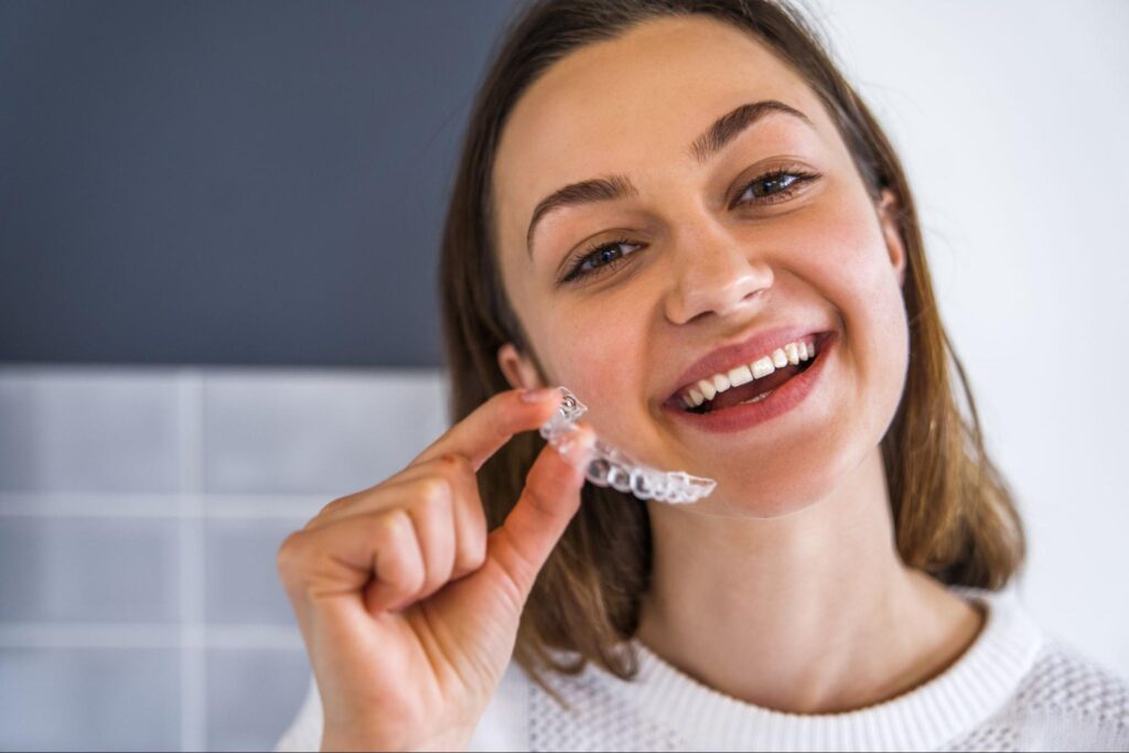 Female patient enjoying her Invisalign in Lubbock.