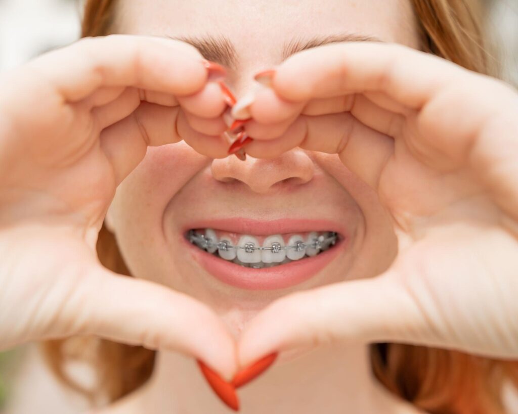 Female patient loving her braces in Lubbock.